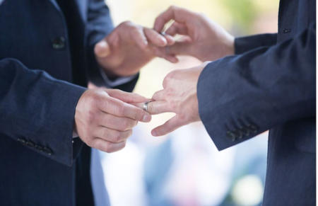 Pic: Alan and Ben exchange the first gift of their marriage